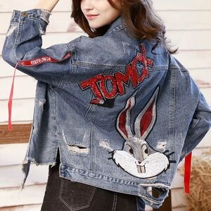 Distressed Denim Jacket with Red Ribbon Accents